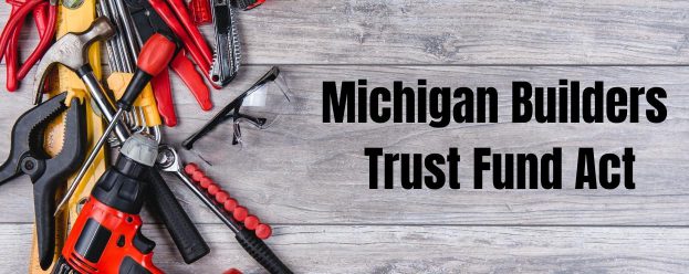 Michigan builders trust fund act with a pile of tools