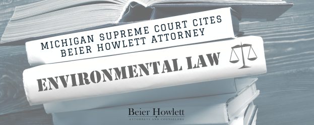 a stack of books with different titles stating environmental law, Michigan Supreme Court Cites Beier Howlett Attorney, and Beier Howlett