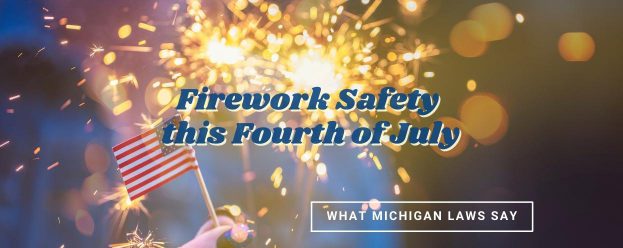 people blurred in the background holding sparklers and little American flags which represents firework safety on the 4th of July and what Michigan law says about it