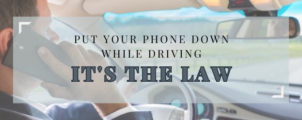 a man driving with one hand while he is talking on the phone is now illegal so you must put your phone down while driving in Michigan
