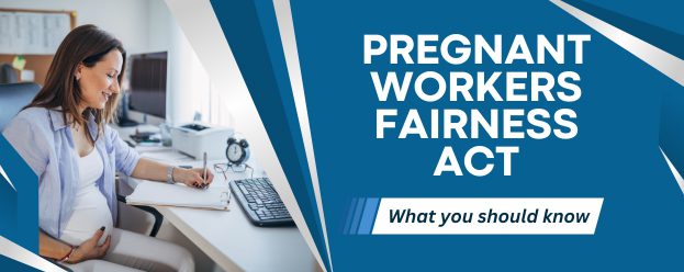 image of a pregnant women working at a desk to go with the pregnant workers fairness act and info you should know